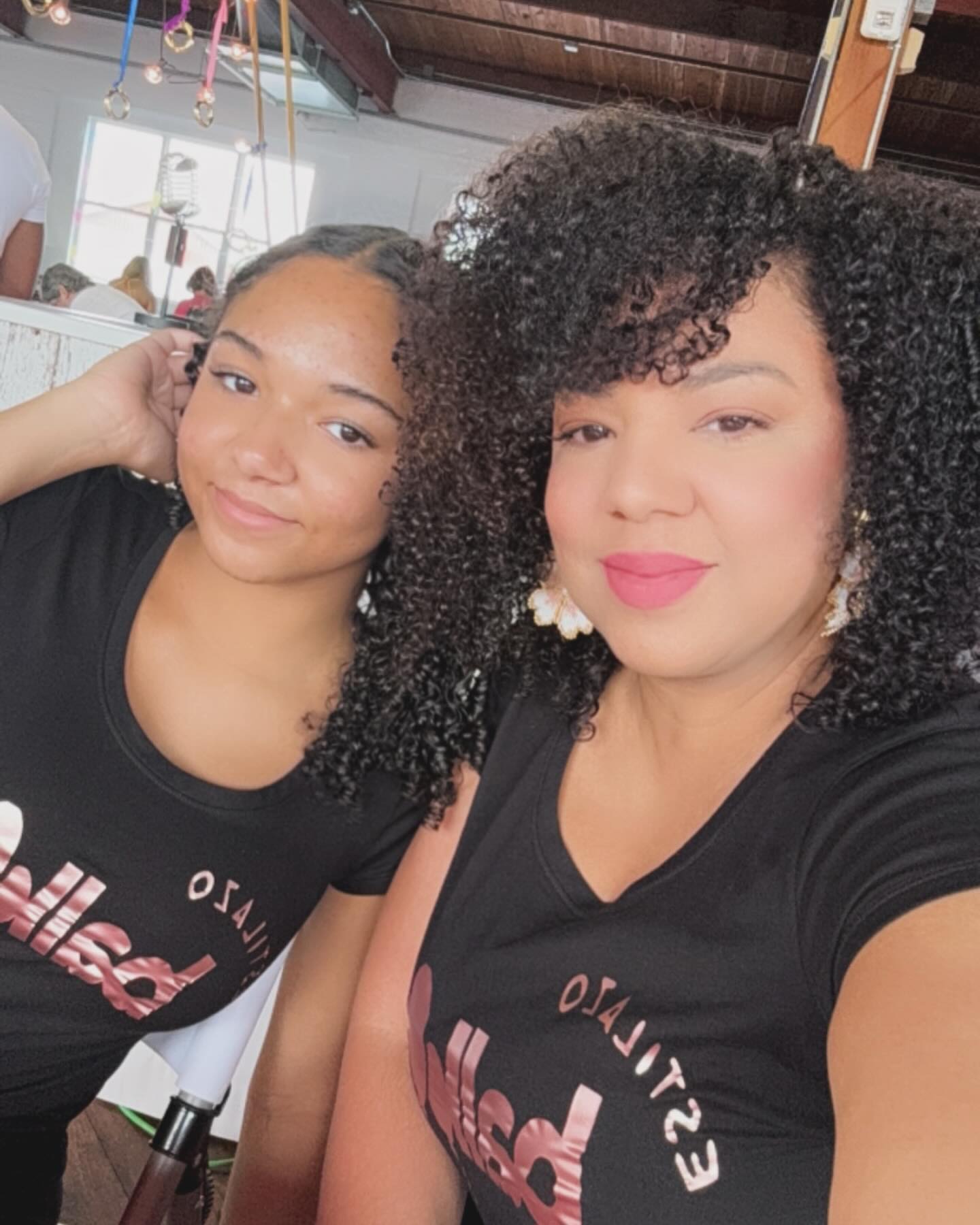 Amaris M. Castillo, founder of Estilazo Balloons, with her daughter in branded tees