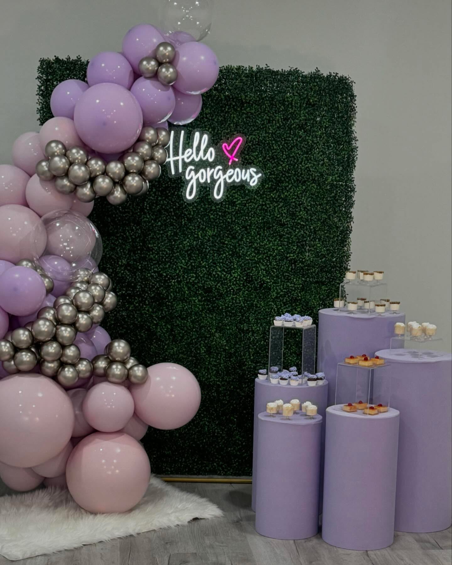 Lavender and chrome balloon garland on greenery wall with Hello Gorgeous neon sign